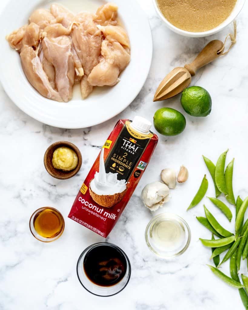 coconut lime chicken ingredients on marble backdrop 