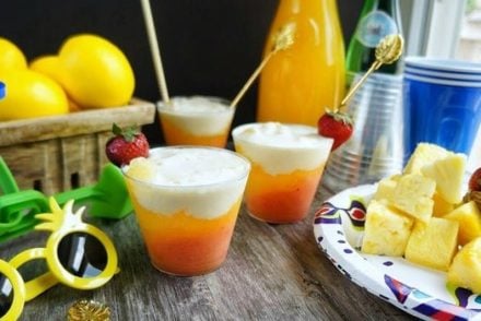 Layered mango coconut mocktails! The tropical flavor and frosty chill are the perfect combination for a fun summer drink!