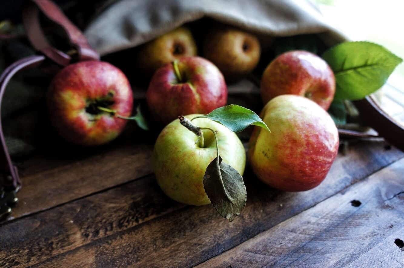 orchard apples spilling out of a bag