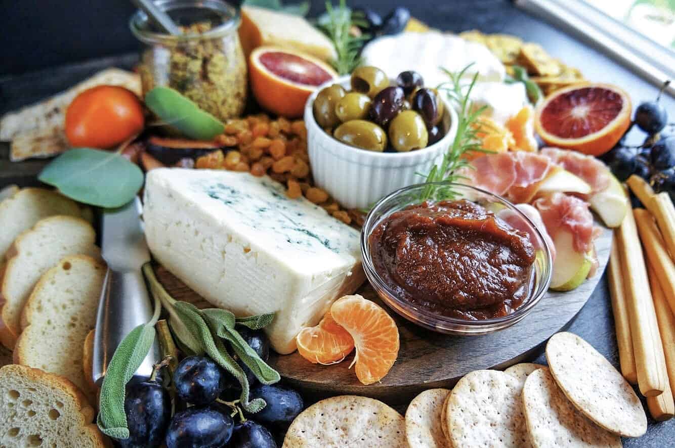 blue cheese wedge and apple butter on fall cheese board