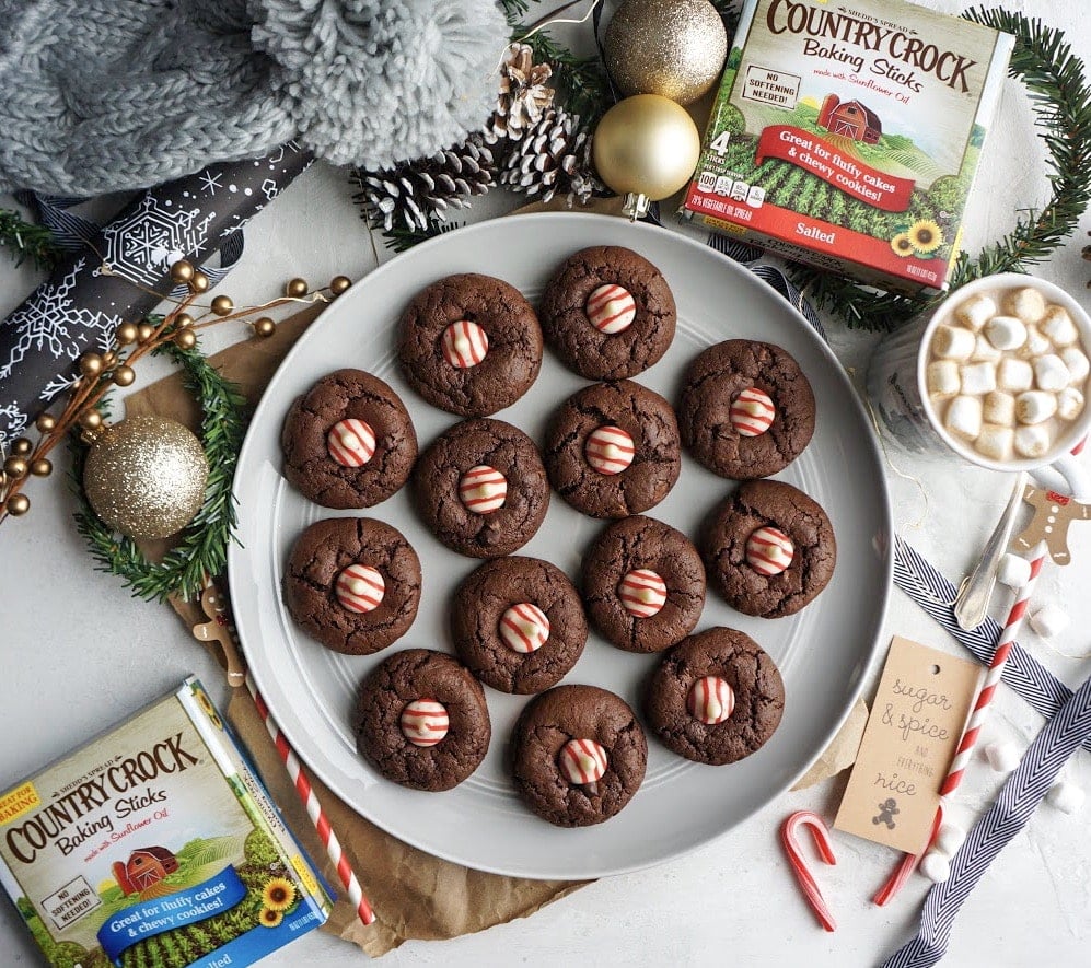 Double Chocolate Peppermint Kiss Cookies on a plate with holiday surroundings