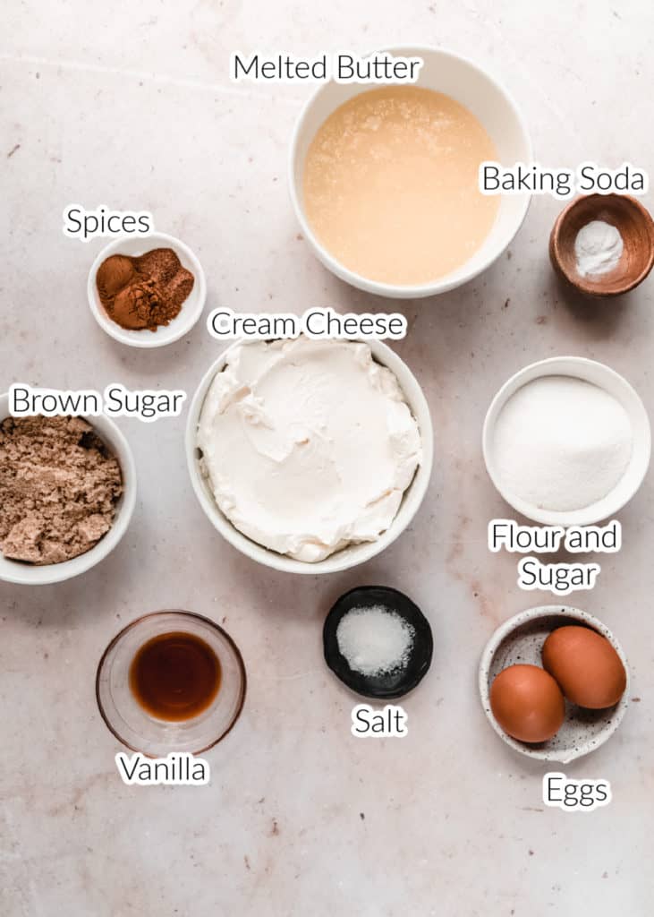 ingredients for snickerdoodle cheesecake bars in bowls