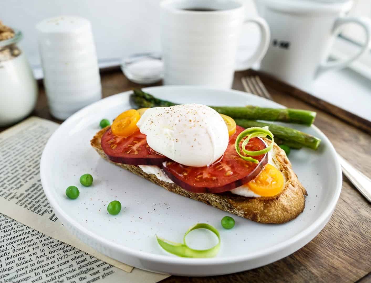 tomato toast with poached egg still in tact