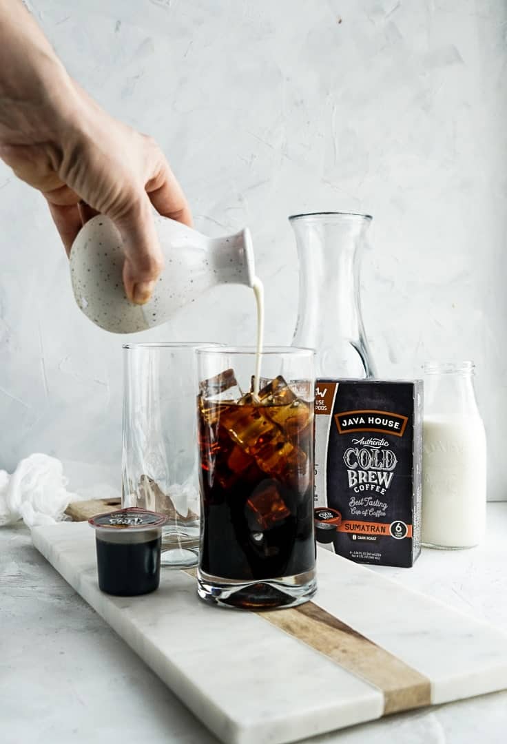 adding milk to cold brew and ice