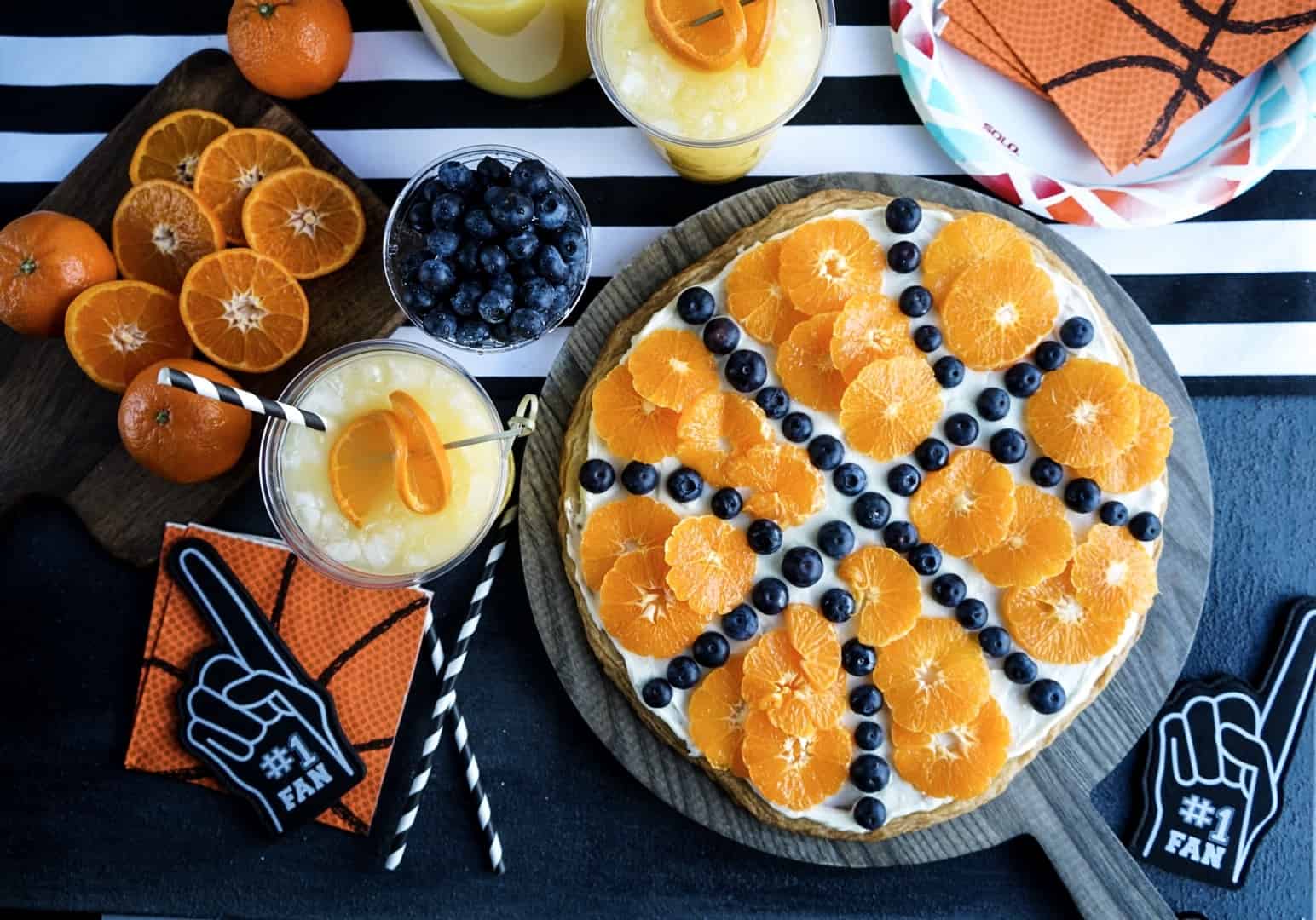 basketball fruit pizza assembled on cutting board