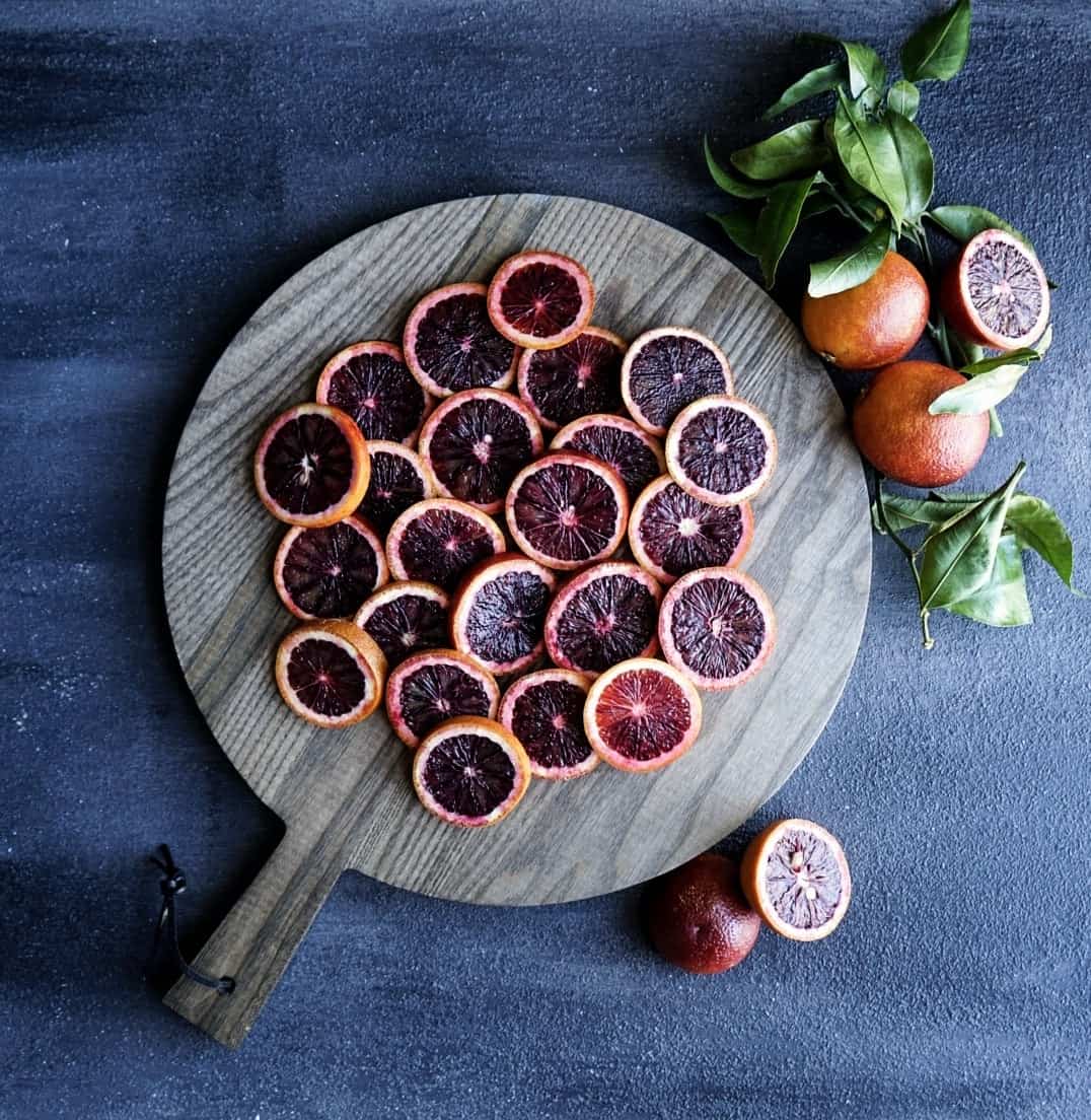 Blood oranges sliced on cutting board
