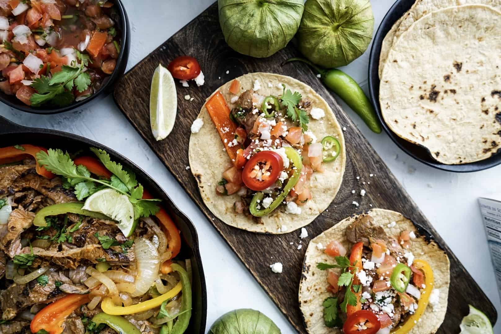 steak fajitas assembled on tortillas