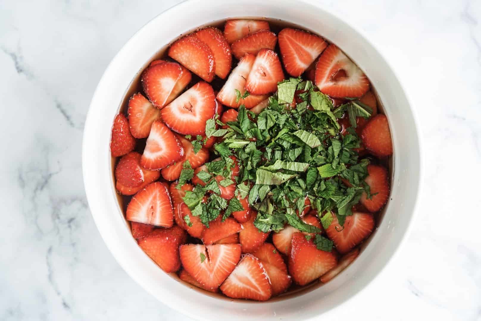 strawberries and mint in a bowl