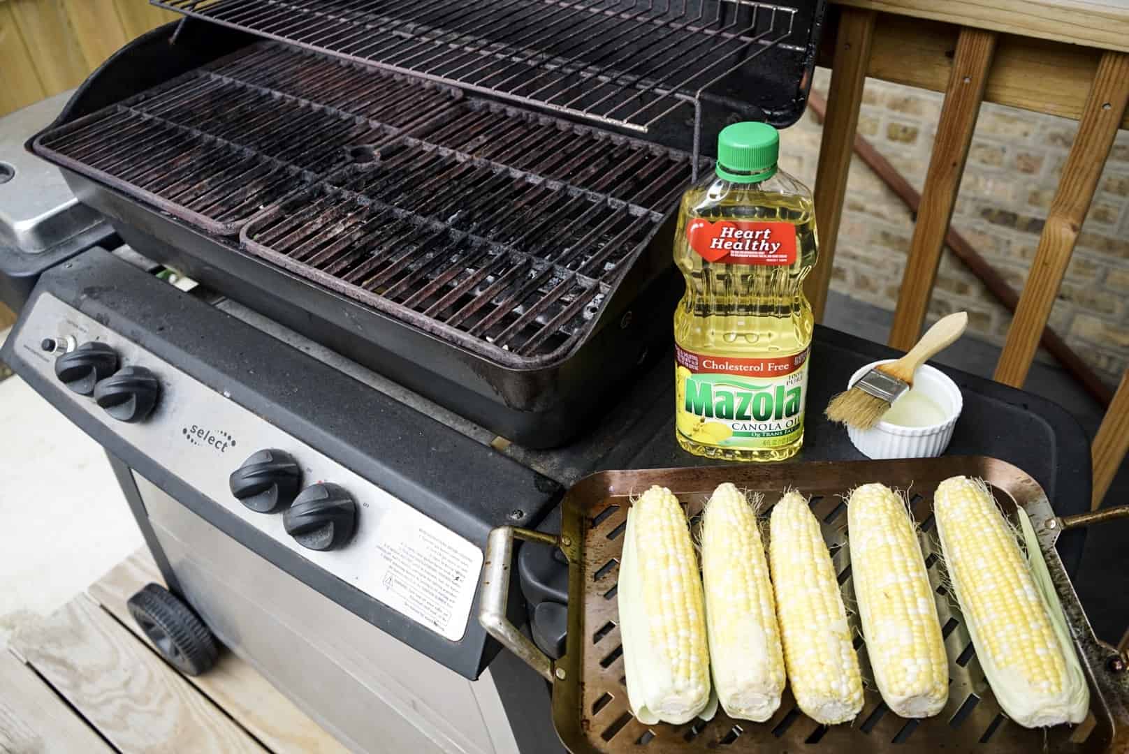prepared corn next to grill