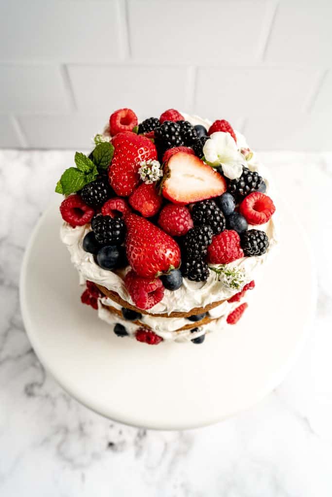 overhead shot of lemon berry layer cake on stand