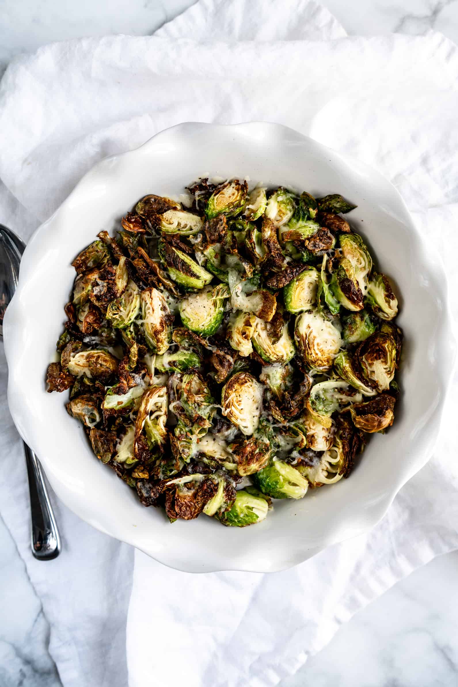 overhead shot of balsamic-roasted brussels sprouts in baking dish 