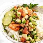 grilled salmon in bowl with grapefruit avocado salsa on top