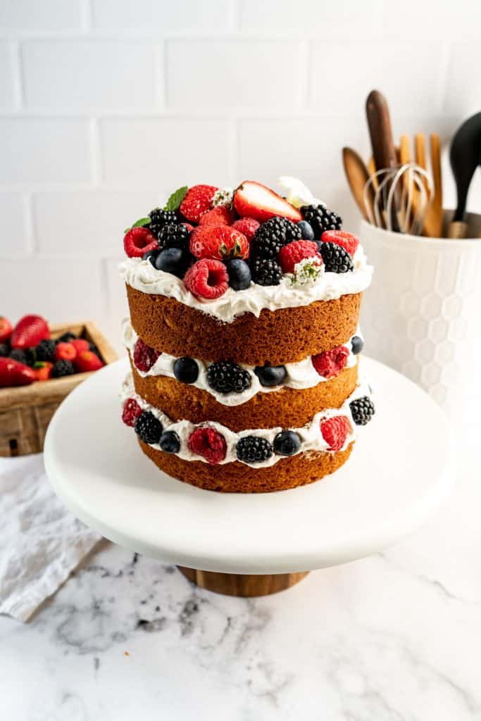 lemon berry layer cake on stand