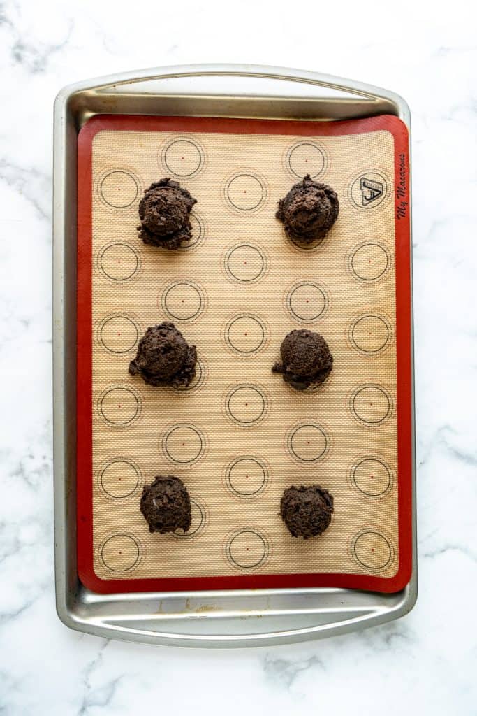 double chocolate chip cookie dough on sheet pan with silpat