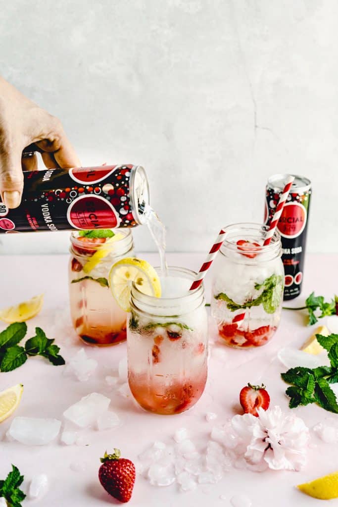 strawberry lemonade smash being poured into glass