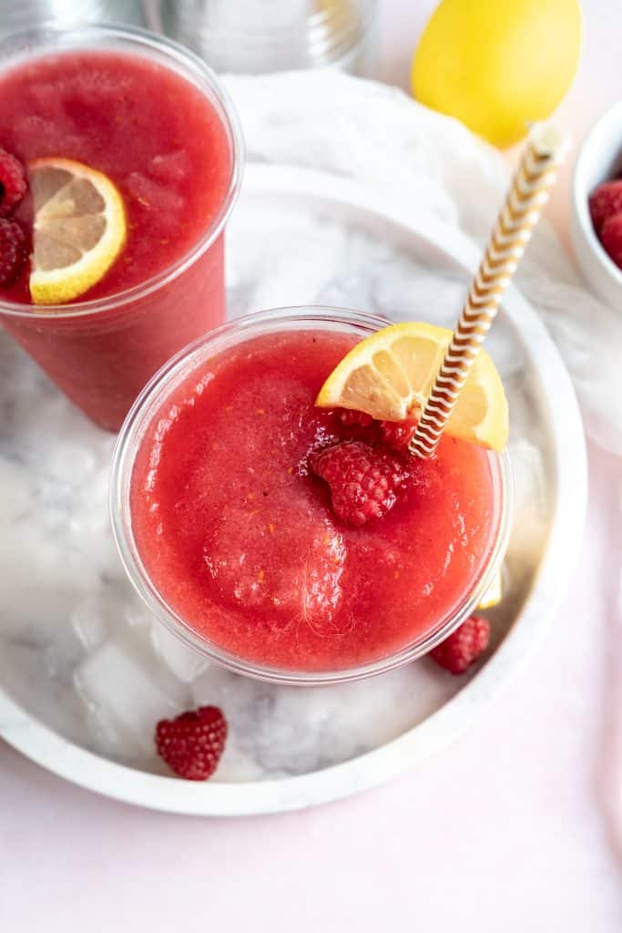 overhead shot of raspberry Frosé with straw