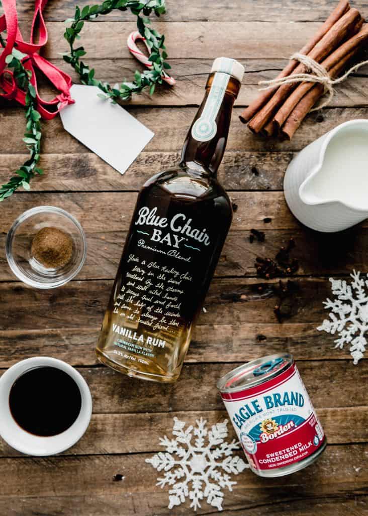 gingerbread coquito ingredients on wood board