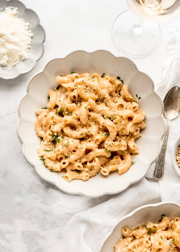 creamy instant pot macaroni and cheese in bowl with panko breadcrumbs on top