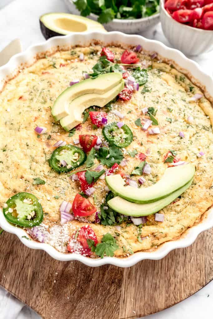 close up of baked taco frittata with garnishes