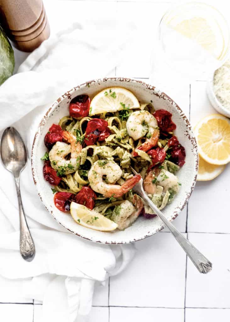 shrimp pesto fettuccine in bowl with fork