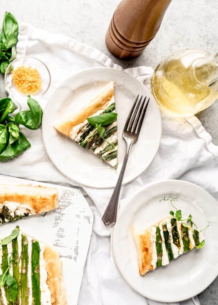 asparagus goat cheese tart sliced on plates 