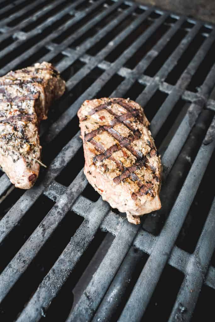 cooked steak on grill with grill marks