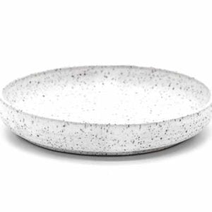 Front-facing view of a shallow white speckled bowl on a white background