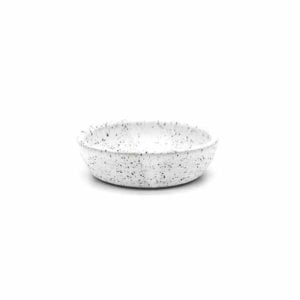 Front-facing view of a white speckled pinch bowl on a white background