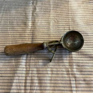 Vintage ice cream scoop with wooden handle