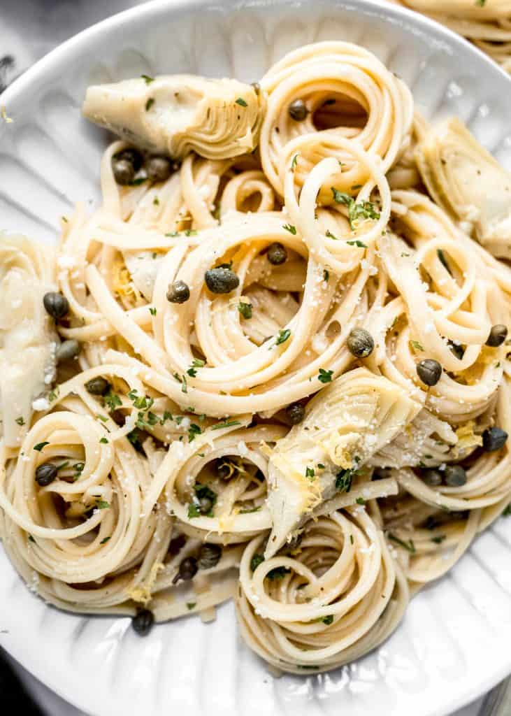 close up shot of lemon artichoke pasta on plate 