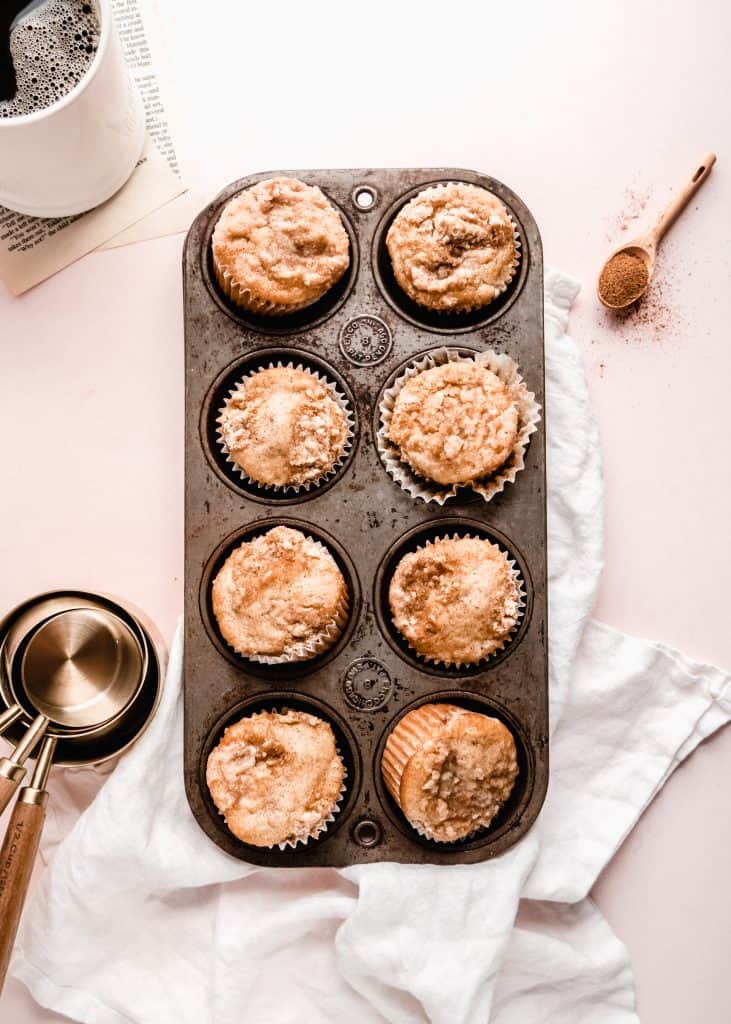 overhead shot of banana streusel muffins in muffin tin 