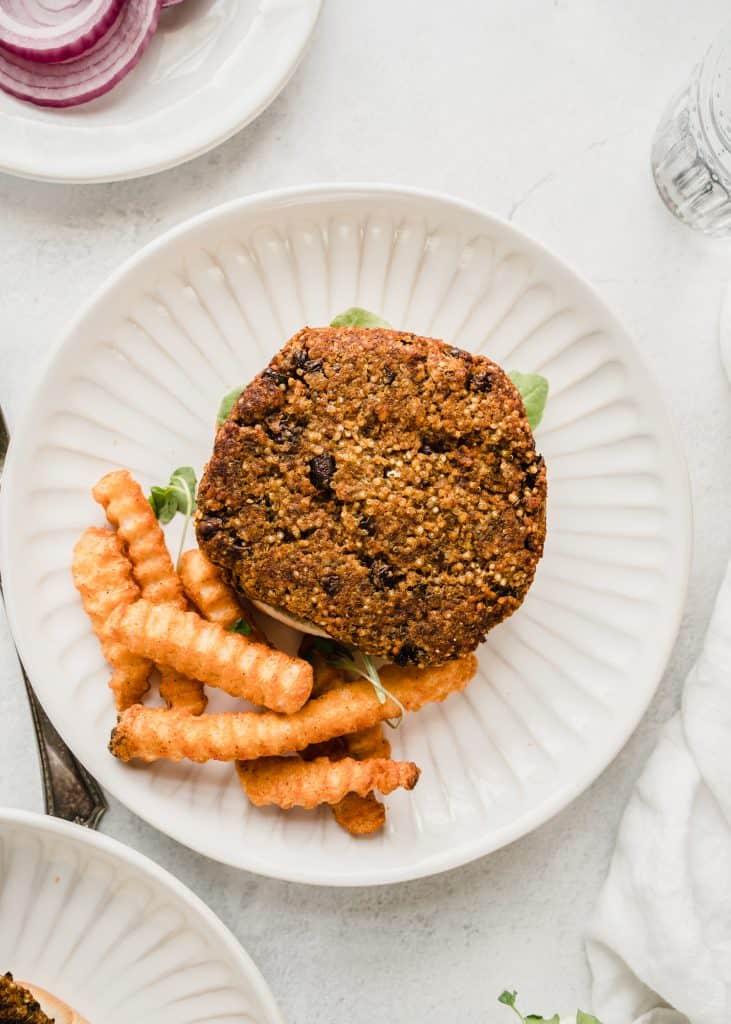 sweet potato black bean burger on plate with fries