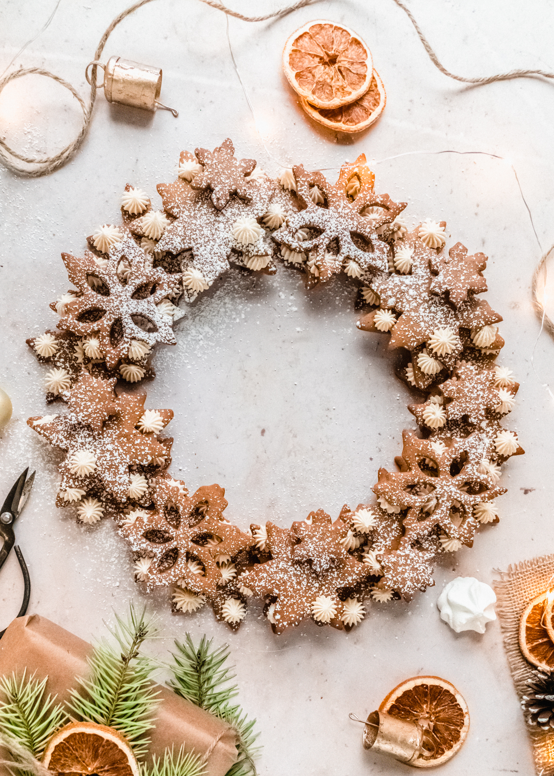 overhead shot of gingerbread wreath dusted with powdered sugar