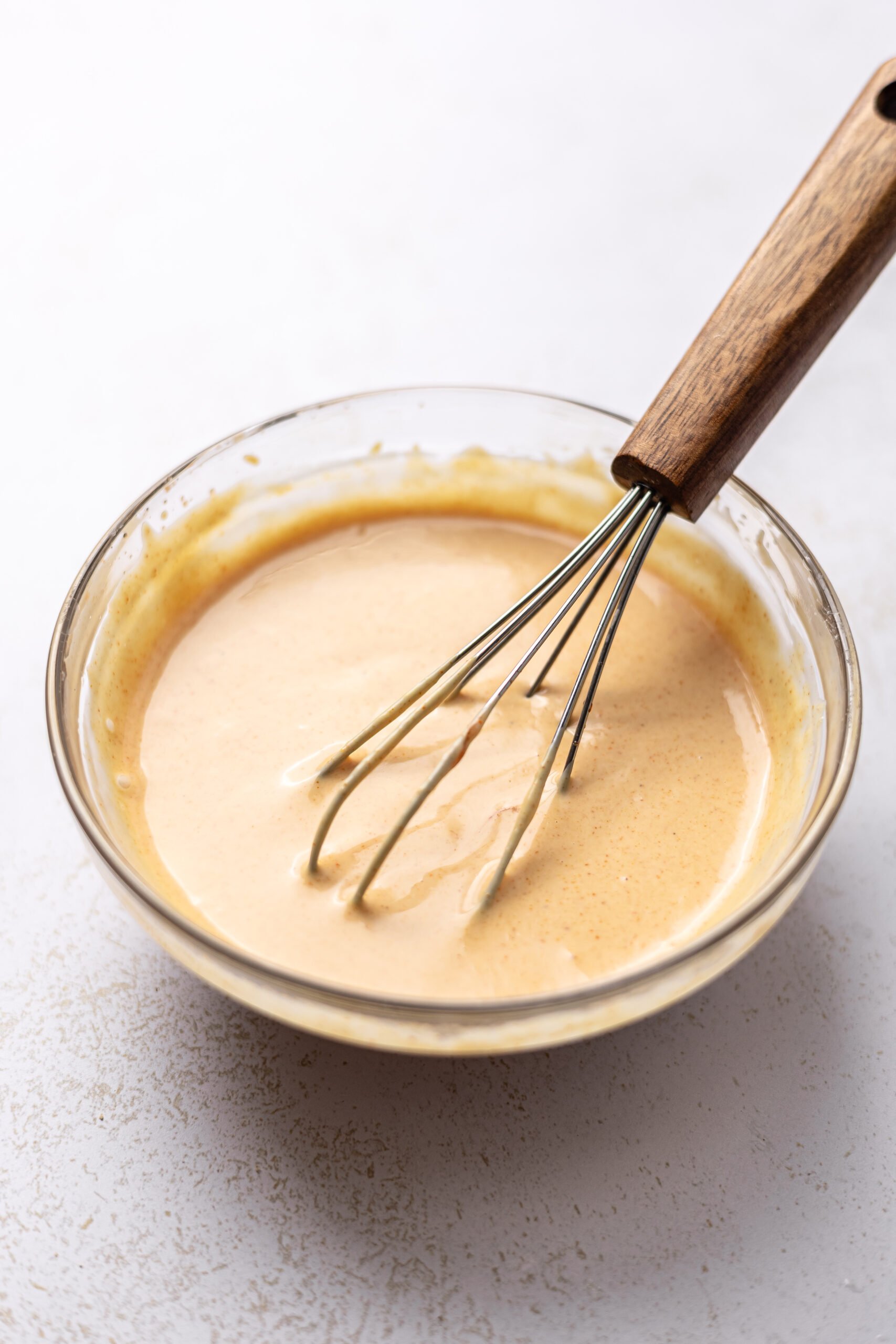 side by side picture of mixing of special sauce for burger bowl 