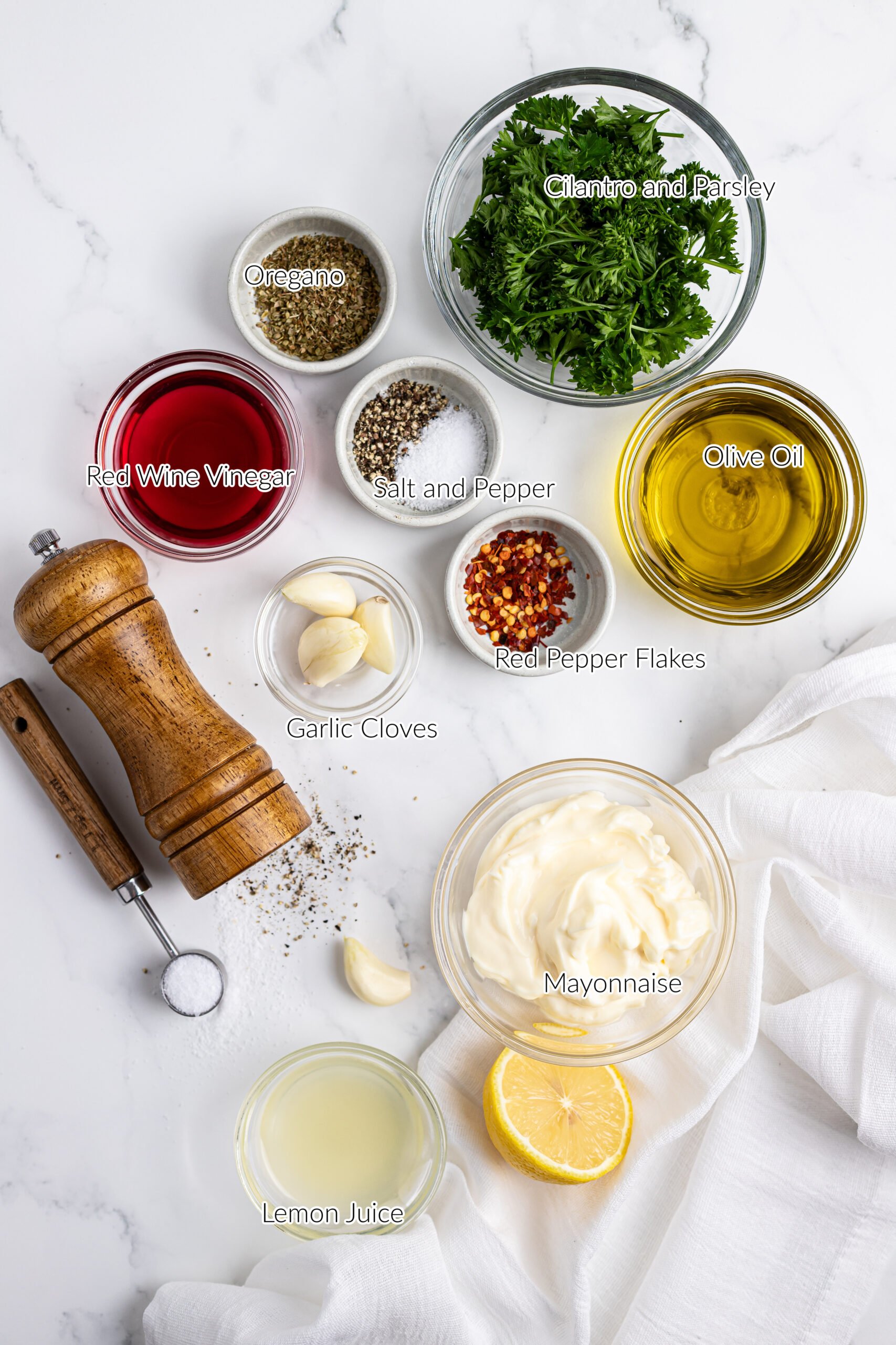 individual ingredients in bowls to make chimichurri aioli